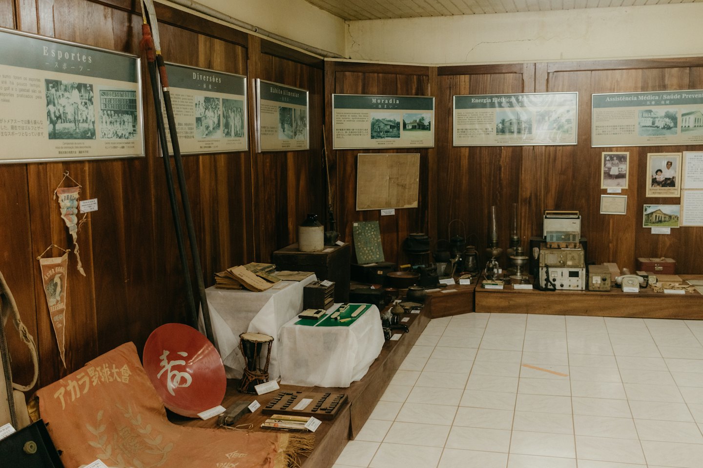 Museum display room with historical artifacts and informational panels.